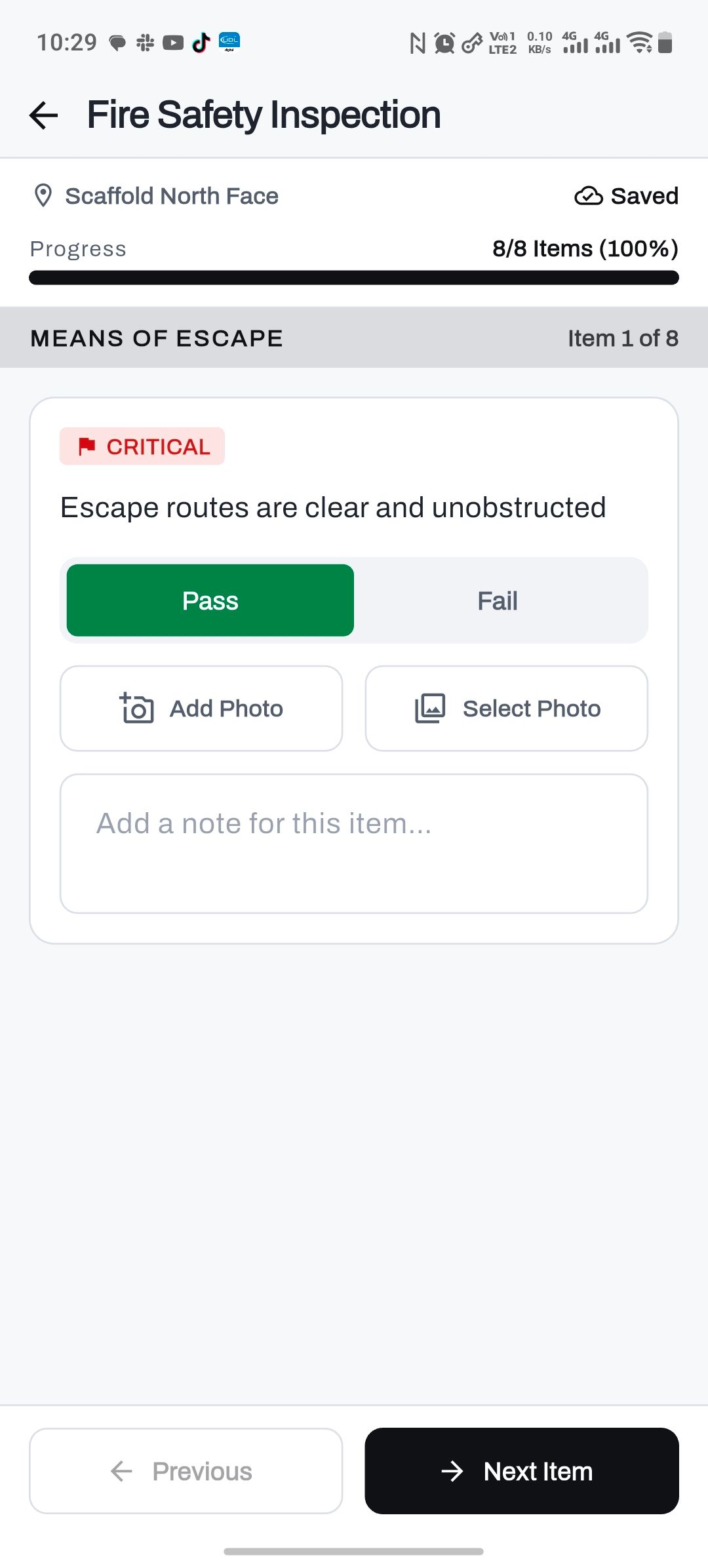 A checklist in FieldAudit Pro on Android: a critical item, escape routes clear and unobstructed, marked Pass, with a photo and a note one tap away.