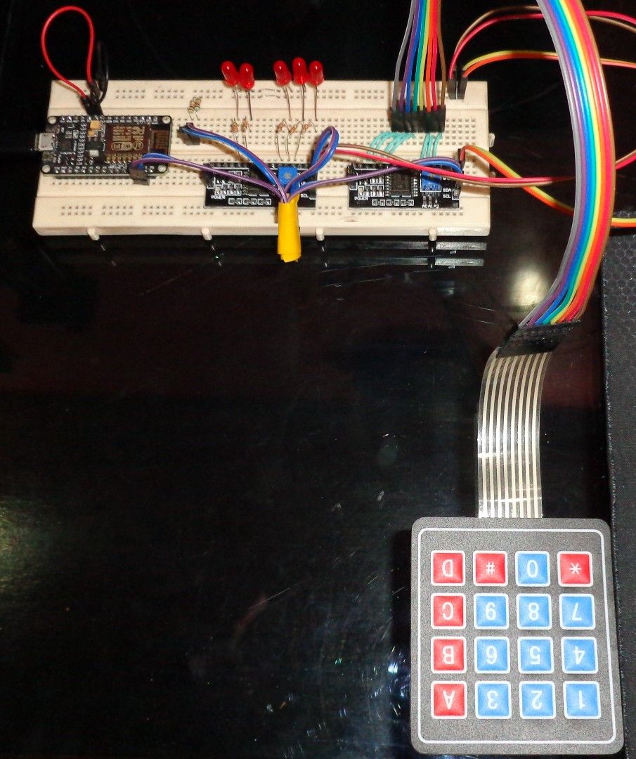 My smart-home test rig: an ESP8266 board on a breadboard, with five LEDs and a 4×4 keypad.